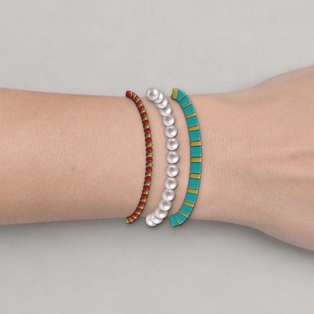 Three beaded bracelets stacked on a wrist