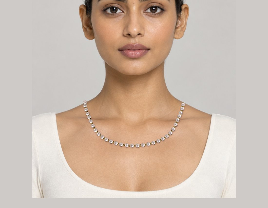 Pearl and gold seed bead necklace on a model